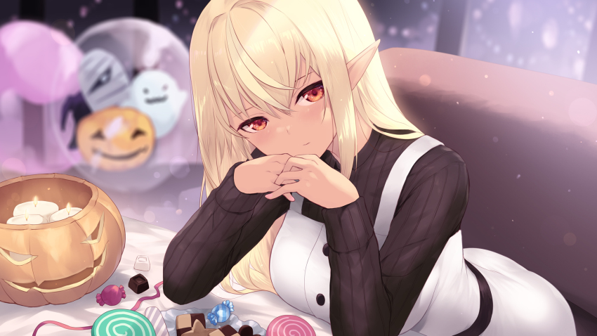 1girl bad_id bad_pixiv_id blonde_hair blurry blurry_background cait_aron candle candy checkerboard_cookie commentary cookie elbow_rest food hair_between_eyes halloween halloween_bucket head_tilt highres hololive indoors interlocked_fingers leaning_forward lollipop long_hair long_sleeves looking_at_viewer pointy_ears red_eyes shiranui_flare solo swirl_lollipop virtual_youtuber