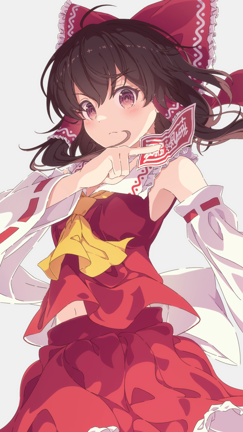 1girl ascot between_fingers blush bow brown_eyes brown_hair closed_mouth commentary detached_sleeves frilled_bow frilled_hair_tubes frills hair_bow hair_tubes hakurei_reimu highres holding long_hair looking_at_viewer namagaki-san ofuda ofuda_between_fingers red_bow red_skirt ribbon-trimmed_sleeves ribbon_trim skirt skirt_set solo touhou yellow_ascot
