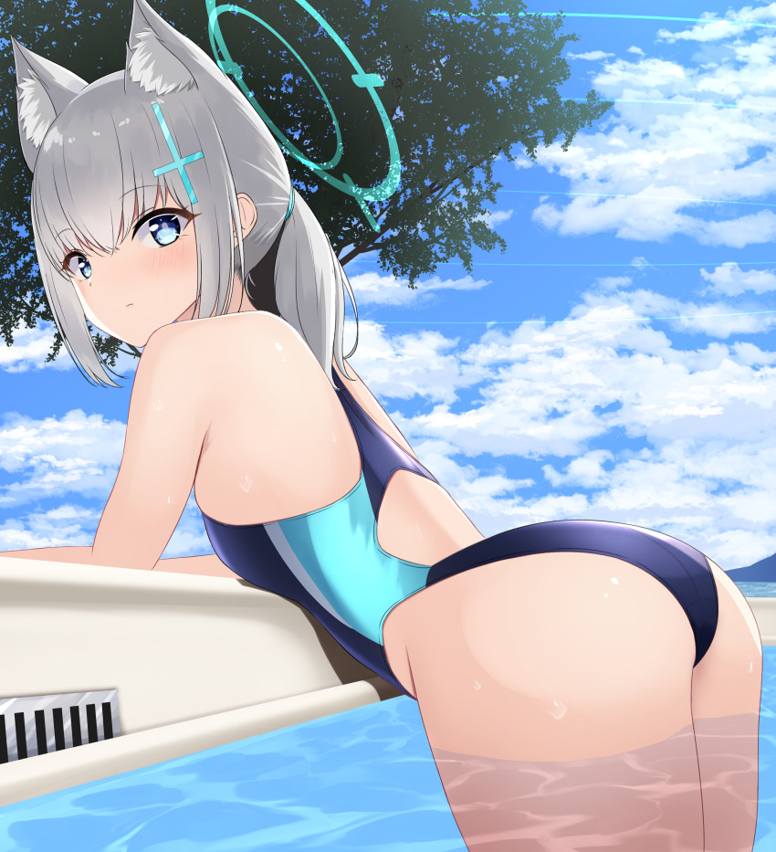 1girl absurdres animal_ear_fluff animal_ears ass black_one-piece_swimsuit blue_archive blue_eyes blue_sky cloud competition_swimsuit cowboy_shot cross_hair_ornament day extra_ears from_behind grey_hair hair_ornament halo highres leaning_forward looking_at_viewer low_ponytail medium_hair mismatched_pupils multicolored_swimsuit nokonoko one-piece_swimsuit outdoors ponytail shiroko_(blue_archive) shiroko_(swimsuit)_(blue_archive) sky solo swimsuit tree water