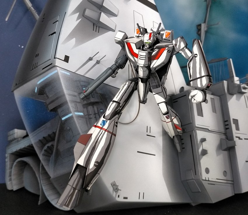 annkoromoti choujikuu_yousai_macross clenched_hands gun highres holding holding_gun holding_weapon looking_down macross mecha model_kit model_kit_(medium) no_humans photo_(medium) robot science_fiction sdf-1 solo unconventional_media vf-1j visor weapon