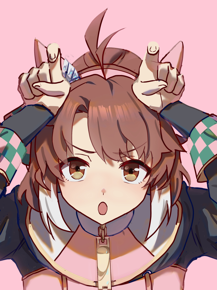 1girl absurdres ahoge animal_ears arms_up brown_eyes brown_hair colored_tips cosplay dantsu_flame_(umamusume) dantsu_flame_(umamusume)_(cosplay) ear_covers ear_ornament highres hood hood_down hoodie horns_pose horse_ears horse_girl looking_at_viewer multicolored_hair no_uwazumi open_mouth pink_background pink_hoodie short_hair simple_background solo streaked_hair umamusume upper_body