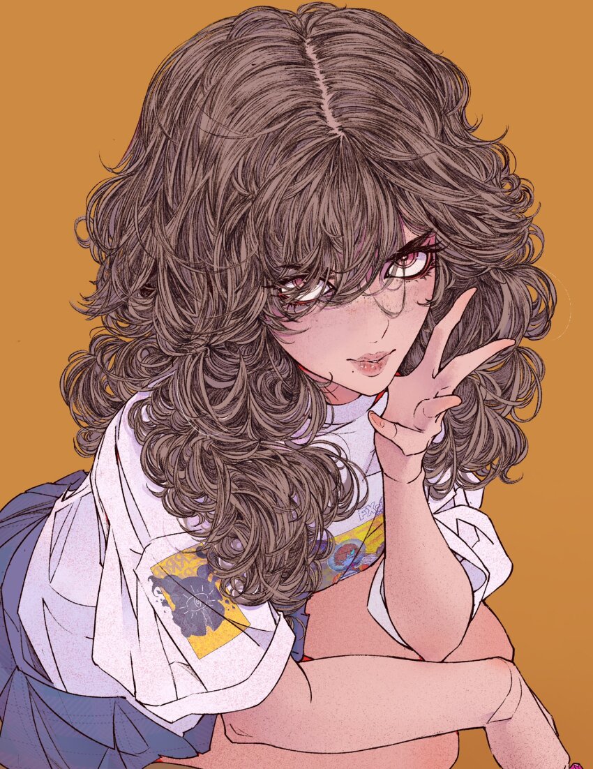 1girl blue_skirt breasts brown_hair elliemaplefox eyelashes feet_out_of_frame fingernails freckles from_above hair_between_eyes hair_over_one_eye hand_over_face hand_up highres holding lips long_hair looking_at_viewer looking_up orange_background original parted_lips pink_eyes print_shirt shirt simple_background sitting skirt solo white_shirt