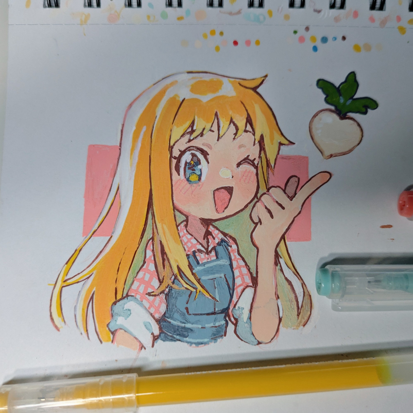 1girl ;d art_tools_in_frame blonde_hair blue_eyes blush bokujou_monogatari claire_(bokujou_monogatari) collared_shirt commentary_request cropped_torso hand_up highres index_finger_raised long_hair looking_at_viewer numbers_(pigpenandpaper) one_eye_closed open_mouth overalls photo_(medium) plaid_clothes plaid_shirt shirt short_sleeves smile solo turnip upper_body very_long_hair