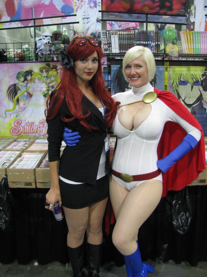 2girls belt blonde_hair breasts cape cleavage cleavage_cutout clothing_cutout cosplay dc_comics gloves highres leotard multiple_girls photo_(medium) power_girl power_girl_(cosplay)