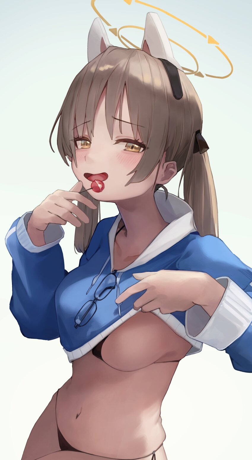 1girl absurdres bikini black_bikini blue_archive blue_hoodie blush breasts brown_eyes brown_hair candy clothes_lift cropped_hoodie food halo highres holding holding_candy holding_food hood hoodie hoodie_lift jun_daniell large_breasts long_hair long_sleeves looking_at_viewer moe_(blue_archive) moe_(swimsuit)_(blue_archive) navel official_alternate_costume open_mouth side-tie_bikini_bottom solo swimsuit yellow_halo