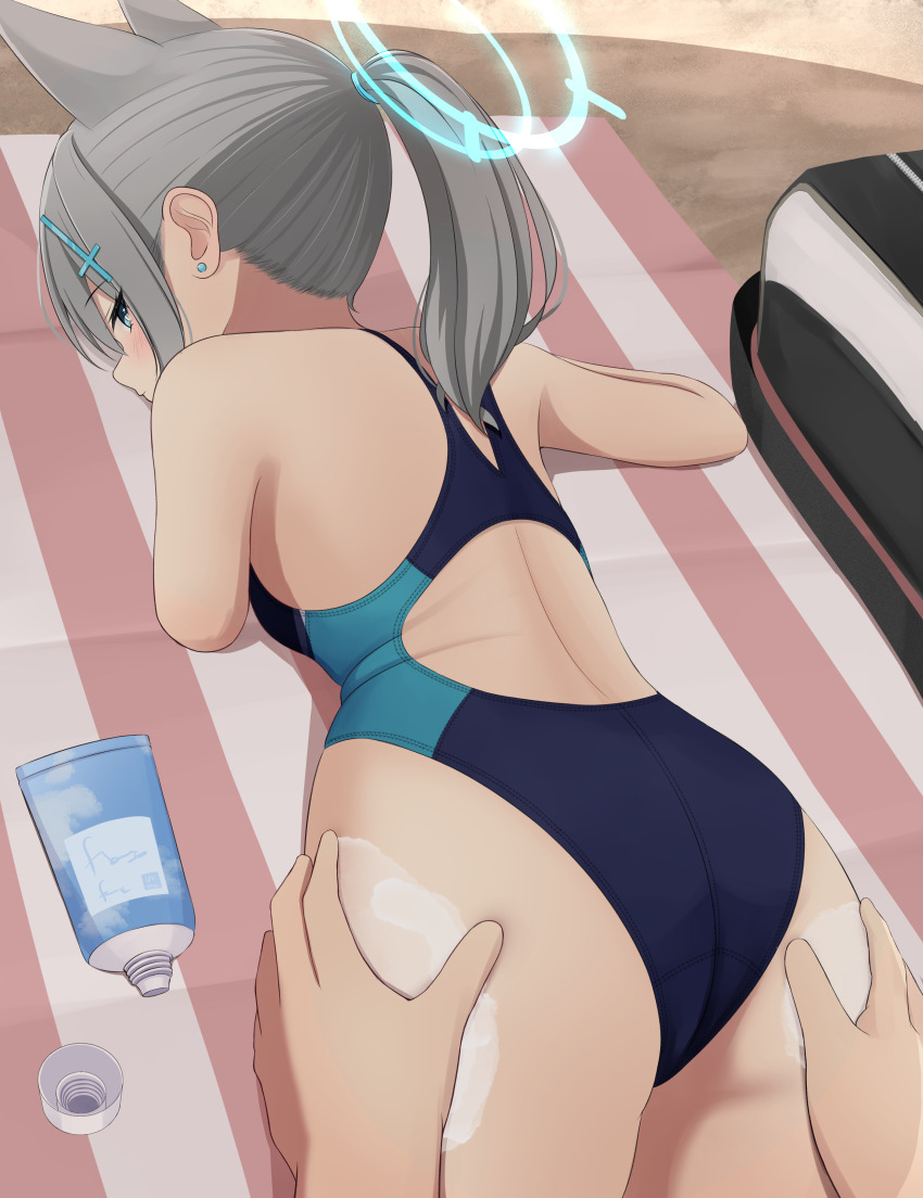 1girl 1other absurdres animal_ear_fluff animal_ears ass bag black_one-piece_swimsuit blue_archive blue_eyes breasts commentary_request competition_swimsuit cowboy_shot cross_hair_ornament extra_ears grey_hair hair_ornament halo highres looking_at_viewer looking_back lotion low_ponytail lying medium_breasts medium_hair mismatched_pupils multicolored_swimsuit nokonoko official_alternate_costume on_stomach one-piece_swimsuit ponytail shiroko_(blue_archive) shiroko_(swimsuit)_(blue_archive) solo_focus sunscreen swimsuit wolf_ears