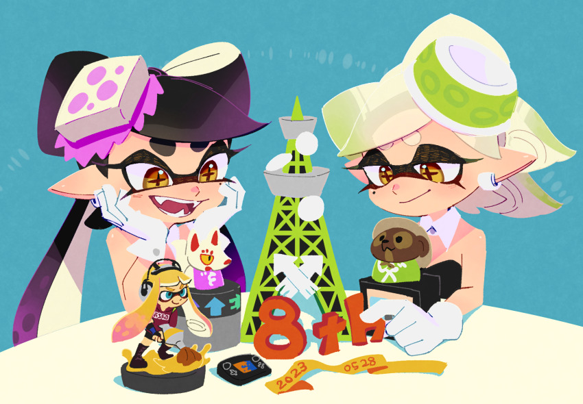 2girls amiibo anniversary bare_shoulders black_dress blue_background blue_eyes callie_(splatoon) callie_(squid_sisters_outfit)_(splatoon) closed_mouth cross-shaped_pupils dated detached_collar dress earrings gloves green_hair highres inkbrush_(splatoon) inkling inkling_girl inkling_player_character jewelry kitsune marie_(splatoon) marie_(squid_sisters_outfit)_(splatoon) mole mole_under_eye multiple_girls nintendo open_mouth pointy_ears purple_hair sharp_teeth sleeveless sleeveless_dress splatoon_(series) suction_cups symbol-shaped_pupils tanuki teeth tentacle_hair thick_eyebrows tower ukata white_gloves yellow_eyes