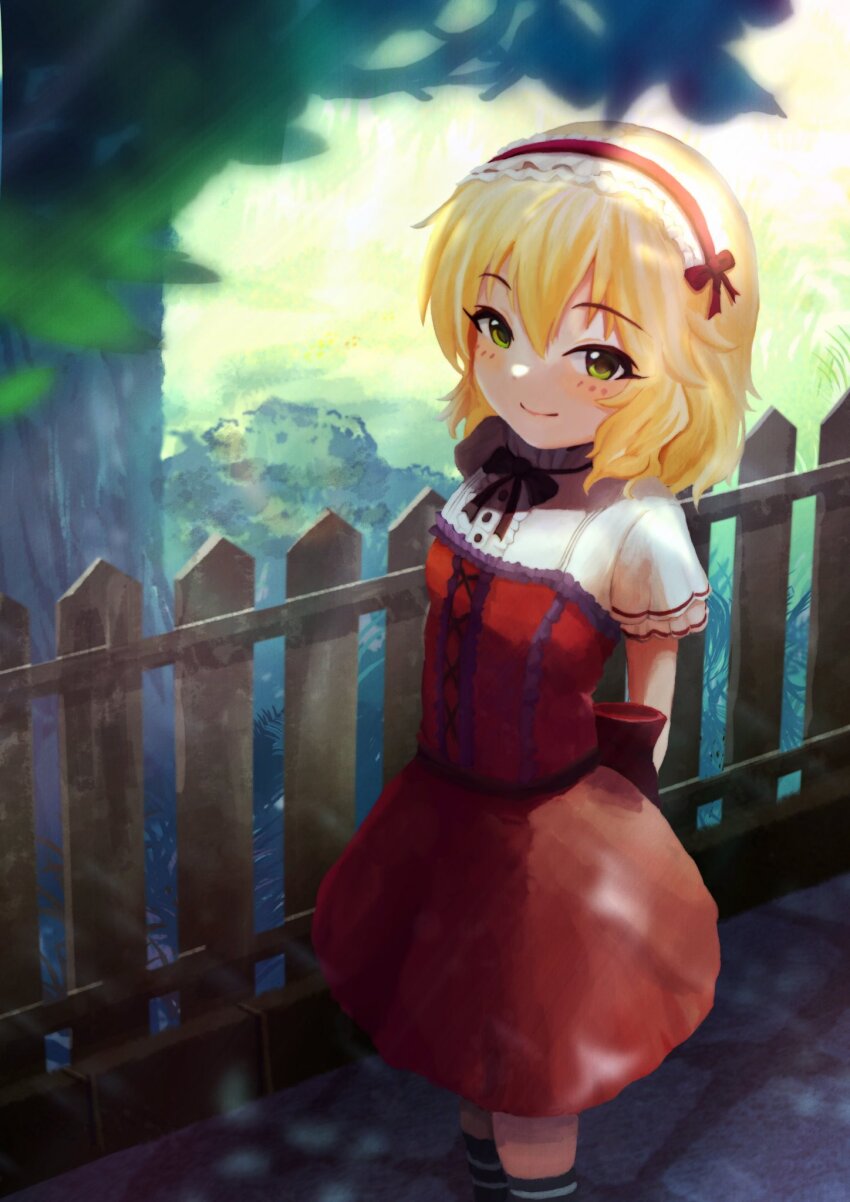 1girl arms_behind_back blonde_hair blush breasts closed_mouth commentary dappled_sunlight day dress feet_out_of_frame fence frilled_hairband frilled_sleeves frills green_eyes hairband highres idolmaster idolmaster_cinderella_girls lolita_hairband looking_at_viewer outdoors red_dress red_hairband rpbpc_8 sakurai_momoka short_hair short_sleeves small_breasts smile socks solo standing striped_clothes striped_socks sunlight symbol-only_commentary tree wavy_hair