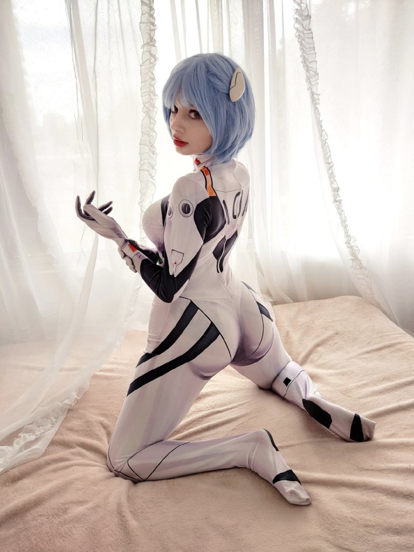 1girl ayanami_rei ayanami_rei_(cosplay) blue_hair cosplay highres mecha_pilot_suit neon_genesis_evangelion on_bed photo_(medium) plugsuit_(cosplay) plugsuit_(evangelion) tagme