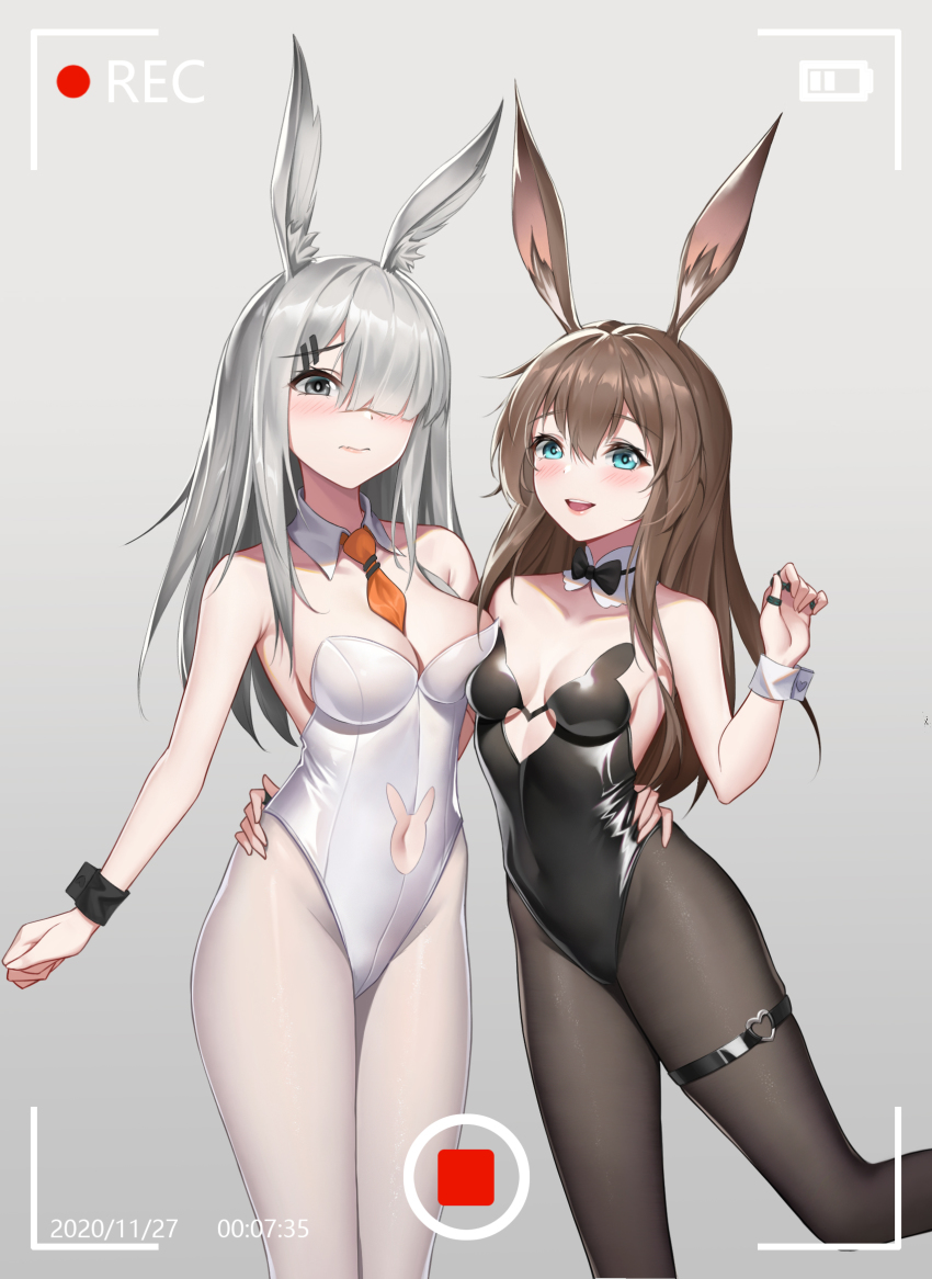 2girls :d amiya_(arknights) animal_band animal_ears arknights battery_indicator black_legwear black_leotard black_neckwear bow bowtie breasts brown_hair chinese_commentary clothing_cutout commentary_request dated detached_collar fake_animal_ears frostnova_(arknights) green_eyes grey_background grey_eyes hair_over_one_eye heart heart_cutout heart_o-ring highres kurosara leotard long_hair looking_at_viewer medium_breasts mixed-language_commentary multiple_girls navel_cutout necktie o-ring open_mouth pantyhose playboy_bunny rabbit_cutout rabbit_ears rabbit_girl rabbit_tail recording silver_hair simple_background small_breasts smile standing strapless strapless_leotard tail thigh_strap traditional_bowtie underboob_cutout white_legwear white_leotard wrist_cuffs yellow_neckwear