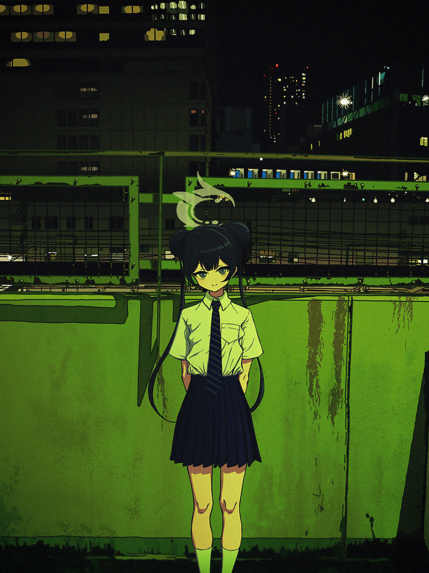 1girl against_wall ankle_socks arms_behind_back black_hair black_skirt blue_archive building city city_lights double_bun fence green_light grey_eyes hair_bun head_tilt highres kisaki_(blue_archive) kisaki_(school_uniform)_(blue_archive) necktie night nkymyura outdoors shirt skirt smile socks striped_necktie urban white_shirt white_socks