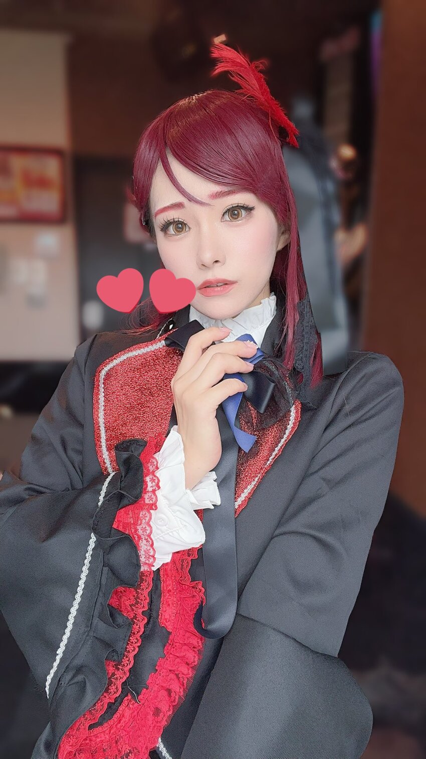 1girl blurry blurry_background cosplay cosplay_photo costume guilty_kiss_(love_live!) heart honamen_cos indoors lipstick long_hair looking_at_viewer love_live! love_live!_sunshine!! makeup photo_(medium) red_hair sakurauchi_riko selfie standing yellow_eyes