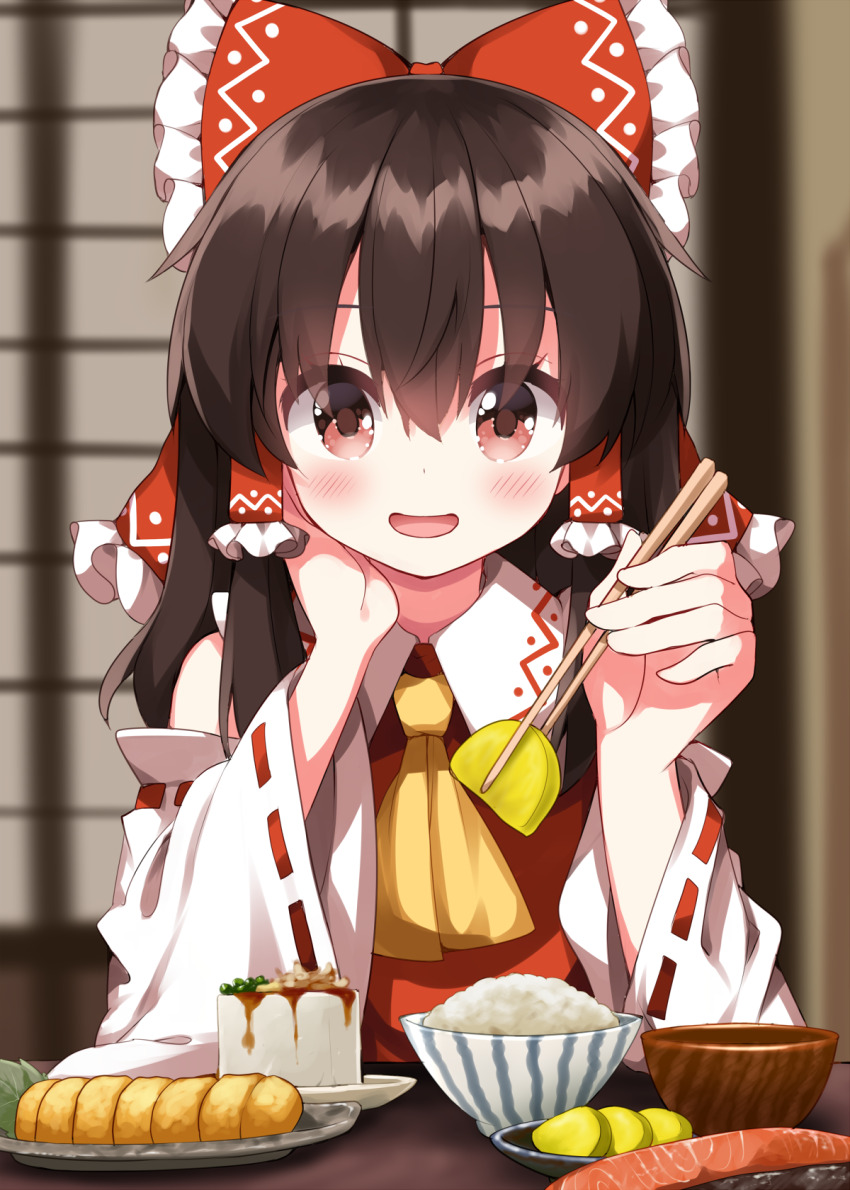 1girl ascot blush bow bowl brown_hair chopsticks detached_sleeves fish fish_(food) food frilled_bow frilled_hair_tubes frills grilled_fish hair_between_eyes hair_bow hair_tubes hakurei_reimu hand_on_own_cheek hand_on_own_face highres hiyayakko_(food) holding holding_chopsticks incoming_food indoors long_hair looking_at_viewer omelet open_mouth plate red_bow red_eyes ribbon-trimmed_sleeves ribbon_trim rice rice_bowl ruu_(tksymkw) salmon shouji sliding_doors smile solo takuan tamagoyaki touhou wide_sleeves yellow_ascot