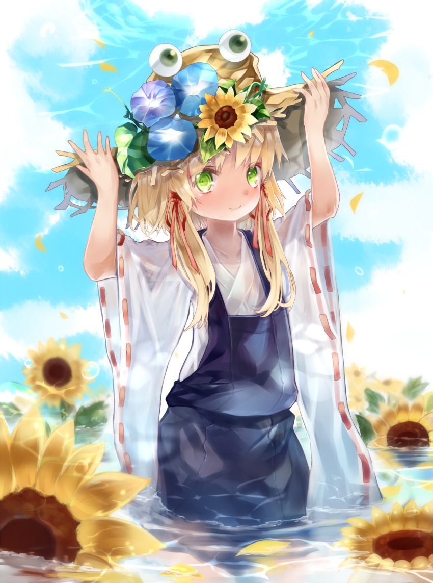 1girl arms_up blonde_hair cloud day eyeball female_focus flower green_eyes hair_ribbon hands_on_headwear hat hat_flower highres in_water leaf looking_at_viewer moriya_suwako morning_glory petals petals_on_liquid red_ribbon ribbon ribbon-trimmed_sleeves ribbon_trim see-through_clothes sidelocks sky smile solo standing straw_hat sunflower syukou touhou tress_ribbon wading water wide_sleeves
