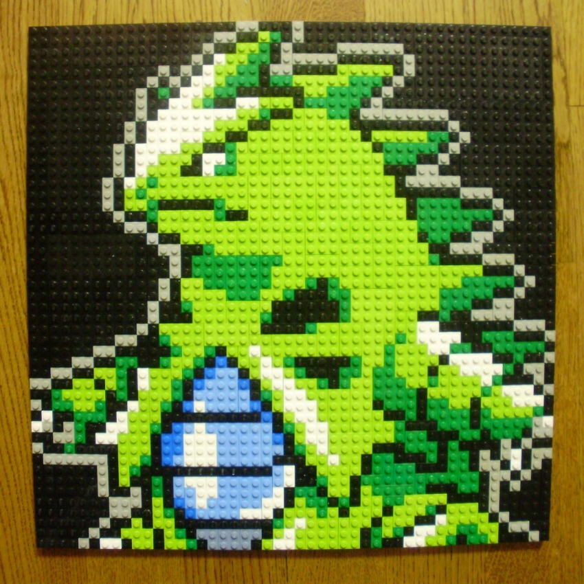 black_background black_eyes claws closed_mouth commentary_request game_freak gen_2_pokemon highres lego lego_(medium) nintendo no_humans photo_(medium) pixel_art pokemon pokemon_(creature) simple_background solo tyranitar unconventional_media upper_body you_rei_(blowback)