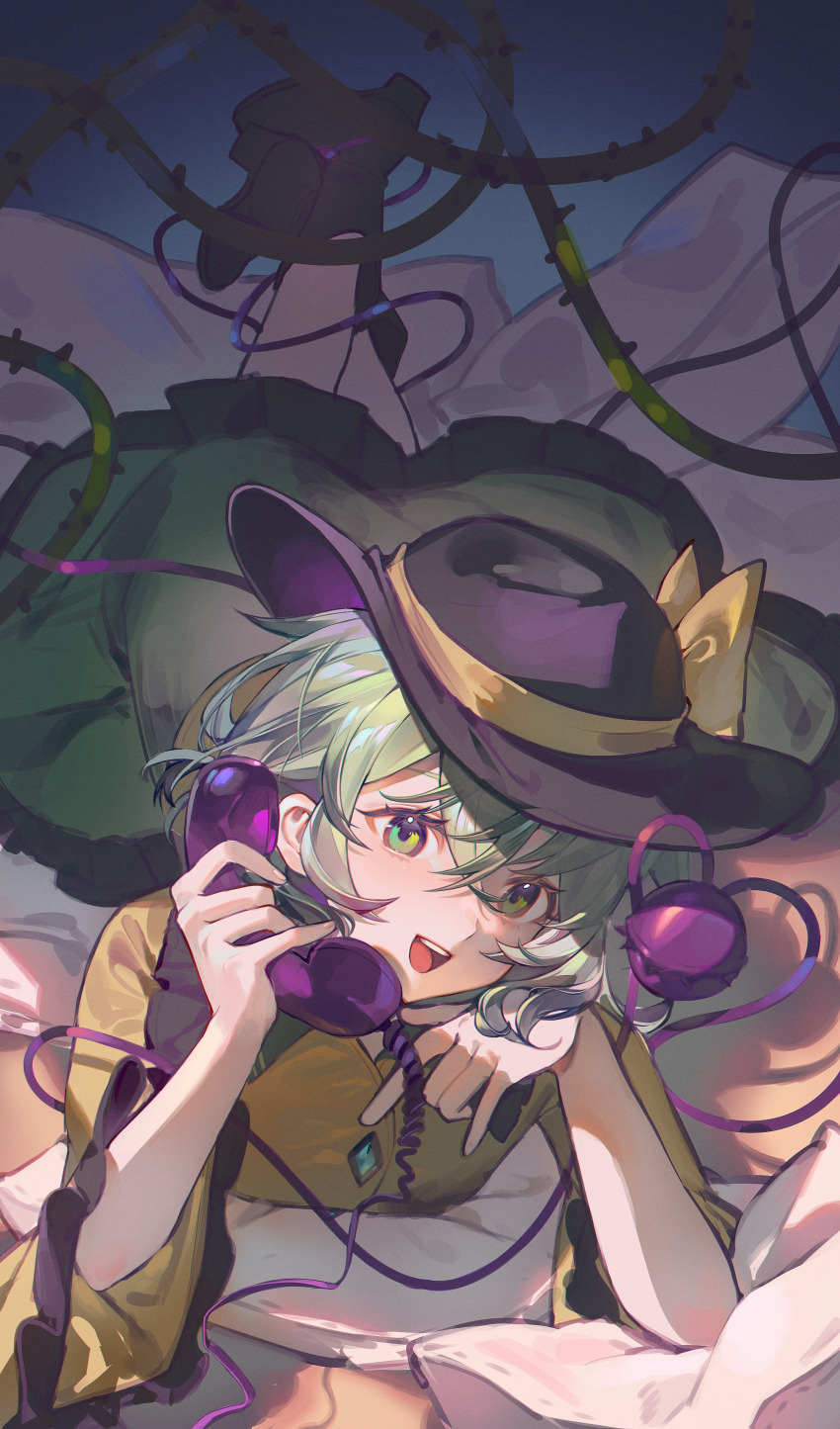 1girl absurdres ankle_boots bed_sheet black_boots black_hat boots bow chinese_commentary collared_shirt commentary ender_xiaohai frilled_shirt_collar frilled_skirt frilled_sleeves frills green_eyes green_hair green_skirt hat hat_bow head_rest heart heart_of_string highres holding holding_phone komeiji_koishi long_sleeves lying on_bed on_stomach open_mouth phone plant shirt short_hair skirt smile solo teeth third_eye thorns touhou upper_teeth_only vines wide_sleeves yellow_bow yellow_shirt