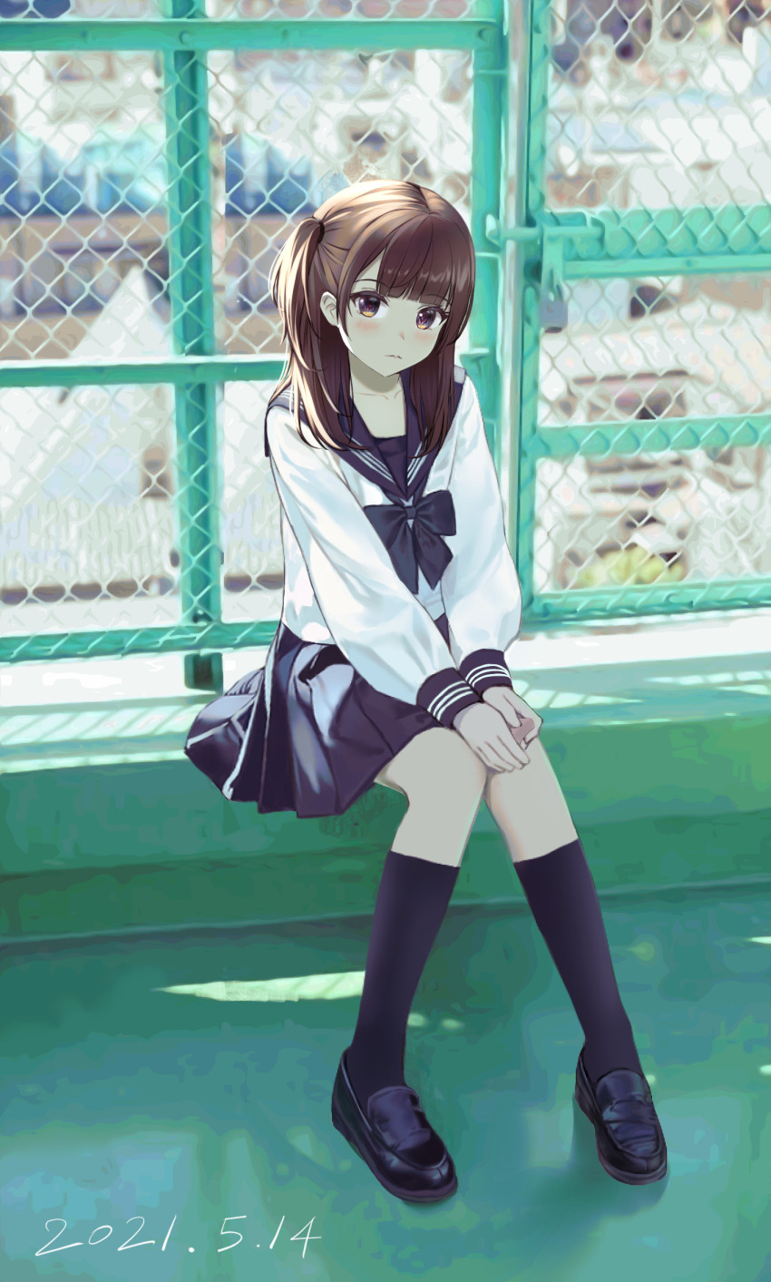1girl black_bow black_shoes black_skirt black_socks blunt_bangs blush bow brown_eyes brown_hair chain-link_fence dated dated_commentary day fence highres kneehighs loafers long_hair long_sleeves looking_at_viewer nay one_side_up original outdoors pleated_skirt revision sailor_collar school_uniform serafuku shoes sitting skirt socks solo