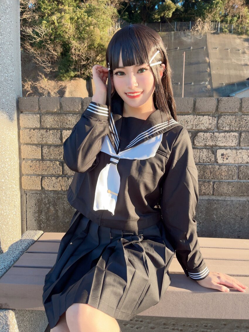 1girl black_hair cosplay cosplay_photo green_eyes honamen_cos kurosawa_dia lipstick long_hair looking_at_viewer love_live! love_live!_sunshine!! makeup outdoors photo_(medium) school_uniform sitting smile