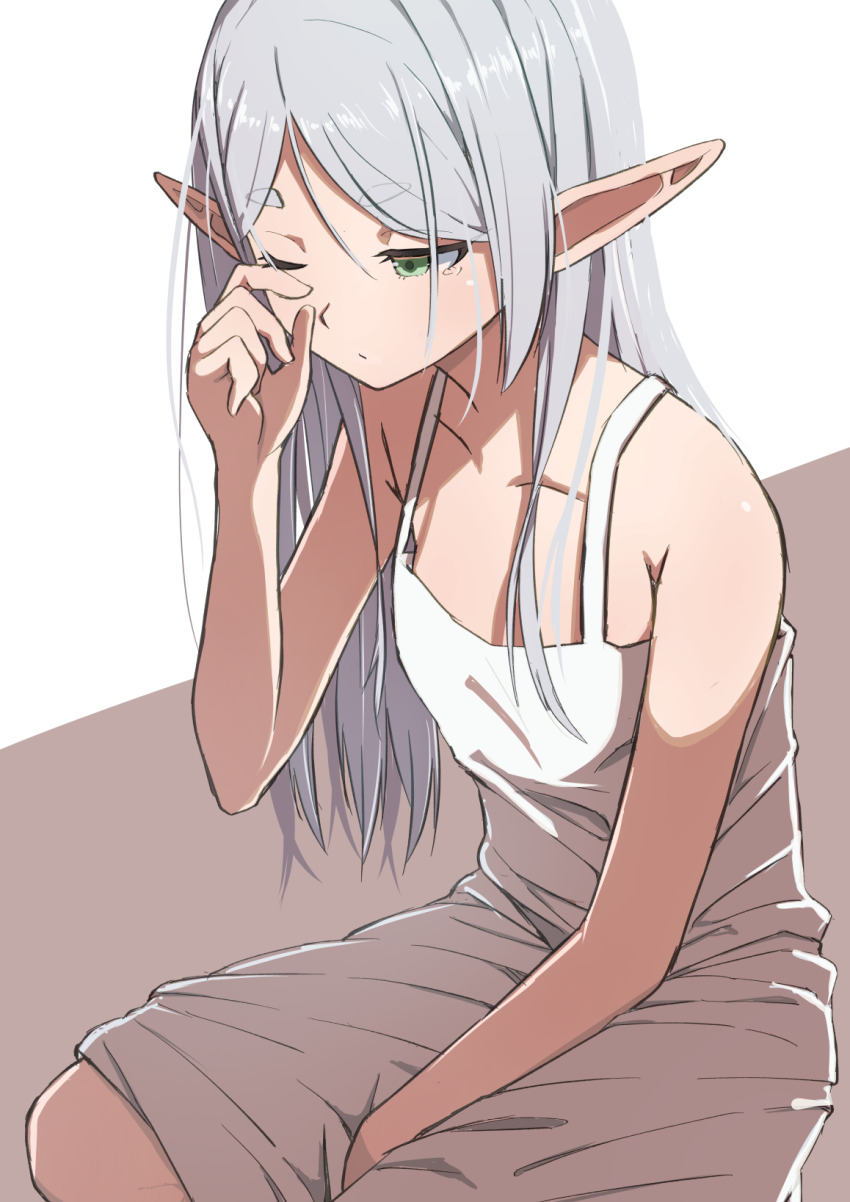 1girl bare_shoulders dress elf expressionless flat_chest frieren green_eyes grey_hair highres long_hair looking_to_the_side one_eye_closed pointy_ears rubbing_eyes sitting solo sousou_no_frieren toraneko white_dress