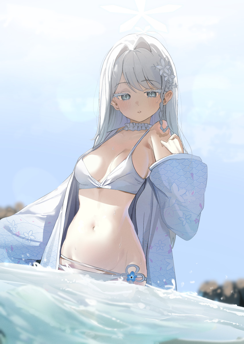 1girl absurdres bikini blue_archive blue_sky blurry blush breasts colored_eyelashes commentary_request day depth_of_field flower grey_eyes hair_flower hair_ornament halo hand_up haori highres inu_lin japanese_clothes long_sleeves looking_at_viewer medium_breasts nagusa_(blue_archive) nagusa_(swimsuit)_(blue_archive) navel ocean official_alternate_costume outdoors partially_submerged sky solo stomach swimsuit water wet white_bikini white_flower white_hair white_halo white_haori