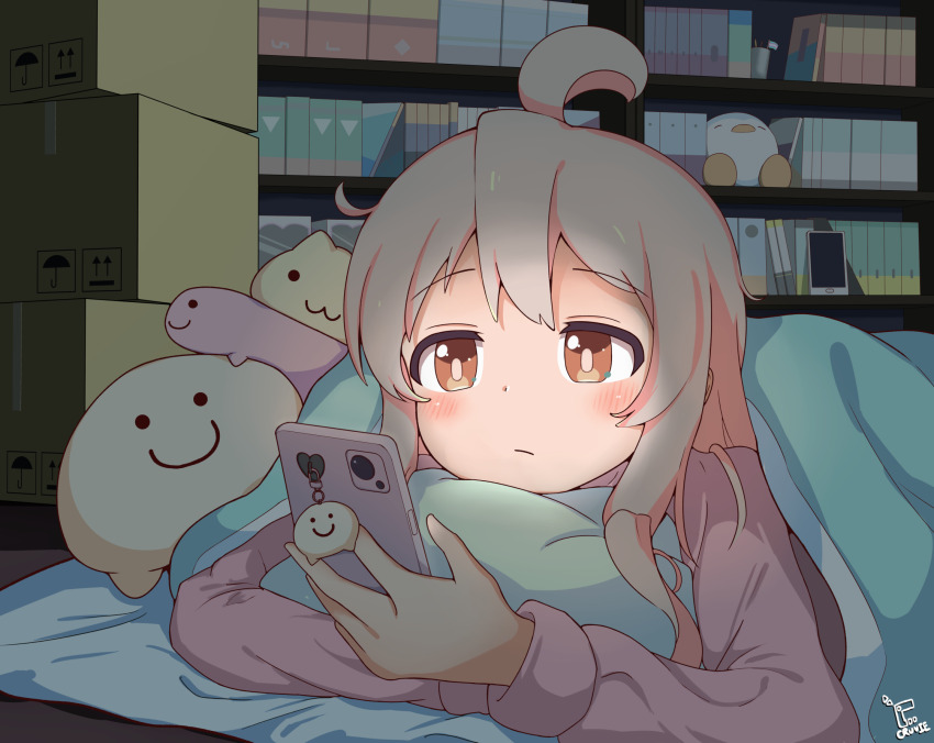 ahoge book bookshelf box brown_eyes cardboard_box cellphone cellphone_charm charm_(object) cruvie hair_between_eyes highres holding holding_phone holding_pillow lying multicolored_hair night on_stomach onii-chan_wa_oshimai! oyama_mahiro phone pillow pink_hair smartphone stuffed_animal stuffed_toy two-tone_hair under_covers