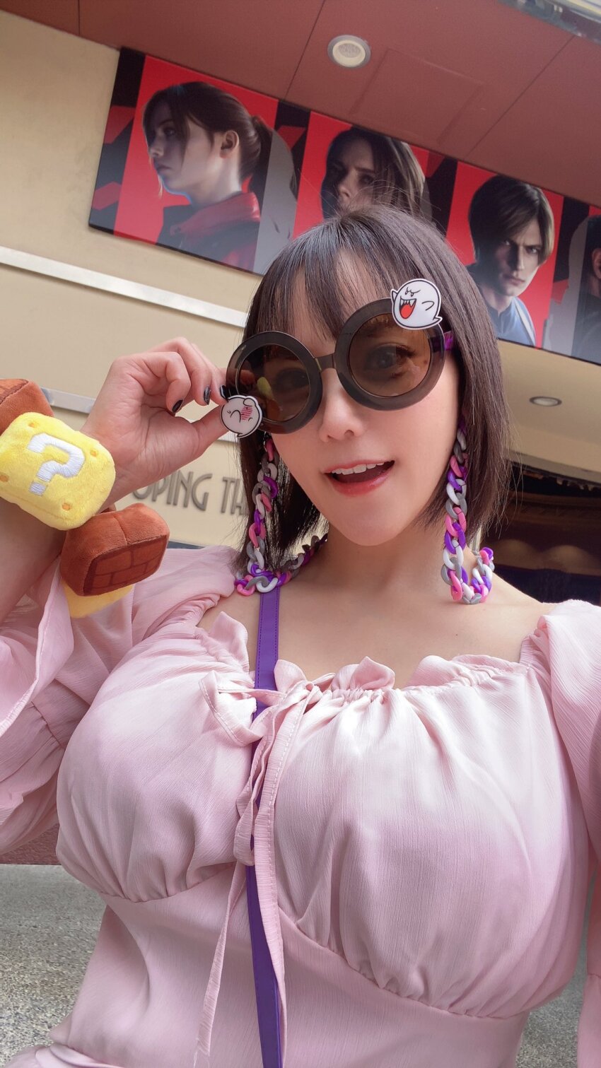 1girl boo_(mario) breasts dress earrings highres japanese_(nationality) jewelry large_breasts looking_at_viewer outdoors photo_(medium) pink_dress real_life selfie shibuya_kaho short_hair standing sunglasses