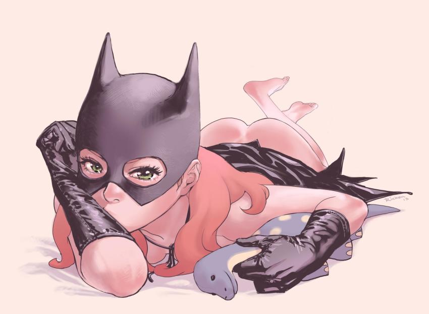 1girl artist_name ass barbara_gordon barefoot batgirl batman_(series) black_gloves dc_comics feet female_focus full_body gloves green_eyes highres legs lying mask on_stomach orange_hair ricken signature solo stuffed_animal stuffed_dinosaur stuffed_toy tears the_pose