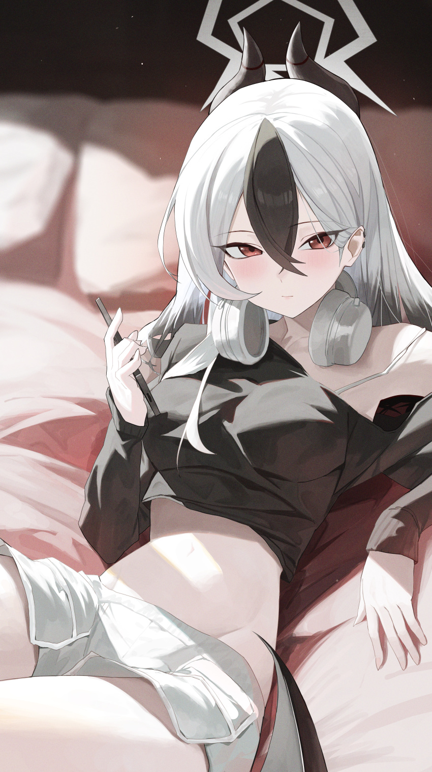 1girl absurdres arm_support black_hair black_horns black_shirt blue_archive bra bra_strap breasts closed_mouth commentary_request cowboy_shot crop_top cropped_shirt crossed_bangs day dolphin_shorts double-parted_bangs expressionless grey_halo grey_shorts hair_between_eyes halo hand_up headphones headphones_around_neck highres holding holding_pen horns indoors kayoko_(blue_archive) large_breasts light_blush long_bangs long_sleeves looking_at_viewer lying midriff multicolored_hair navel off-shoulder_shirt off_shoulder on_bed pen pillow re_naya red_eyes shirt shorts solo stomach strap_slip streaked_hair sunlight underwear white_bra white_hair