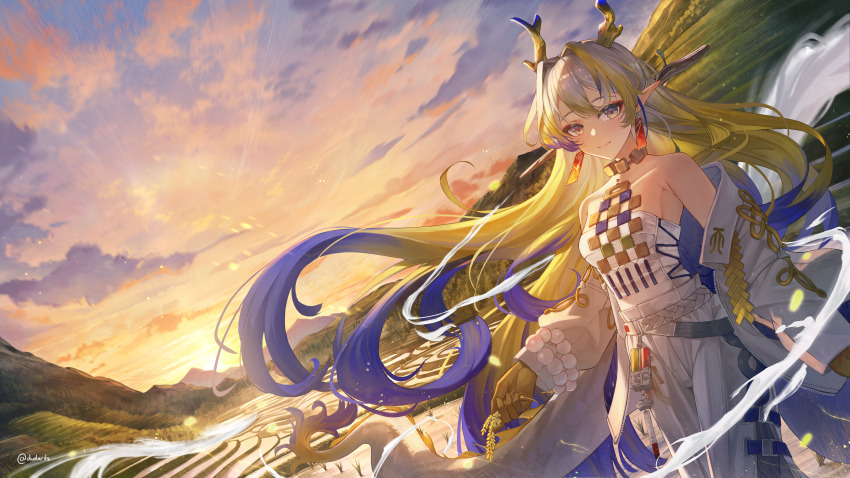 1girl absurdres arknights blonde_hair blue_hair bracelet coat cowboy_shot dvdarts grey_hair hair_intakes highres horns jewelry long_hair looking_at_viewer necklace off_shoulder open_clothes open_coat outdoors pants shu_(arknights) smile solo standing strapless sunset tube_top very_long_hair white_coat white_pants
