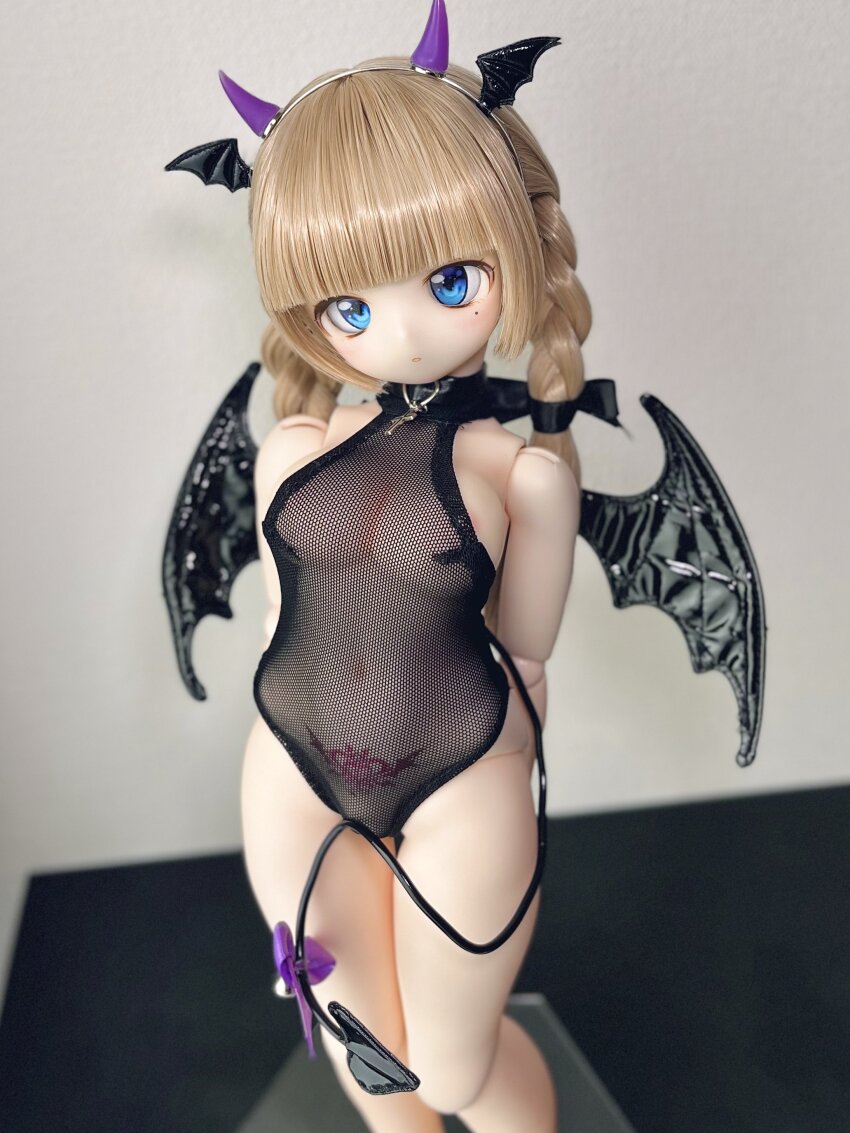 1girl absurdres arms_behind_back blue_eyes figure fishnet_leotard fishnets head_wings highres horns leotard photo_(medium) pubic_tattoo see-through_clothes see-through_leotard tail tattoo wings