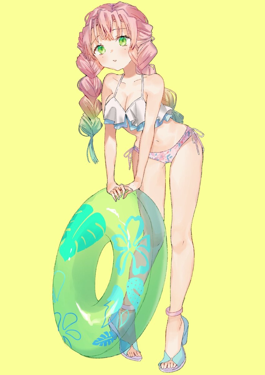 1girl anklet ban_(one_ban7241) bikini blue_sandals braid breasts cleavage collarbone commentary_request full_body gradient_hair green_eyes green_hair green_innertube highres jewelry kanroji_mitsuri kimetsu_no_yaiba leaning_forward long_hair medium_breasts mole mole_under_eye multicolored_hair parted_lips pink_bikini pink_hair sandals side-tie_bikini_bottom simple_background solo standing swimsuit twin_braids white_bikini yellow_background