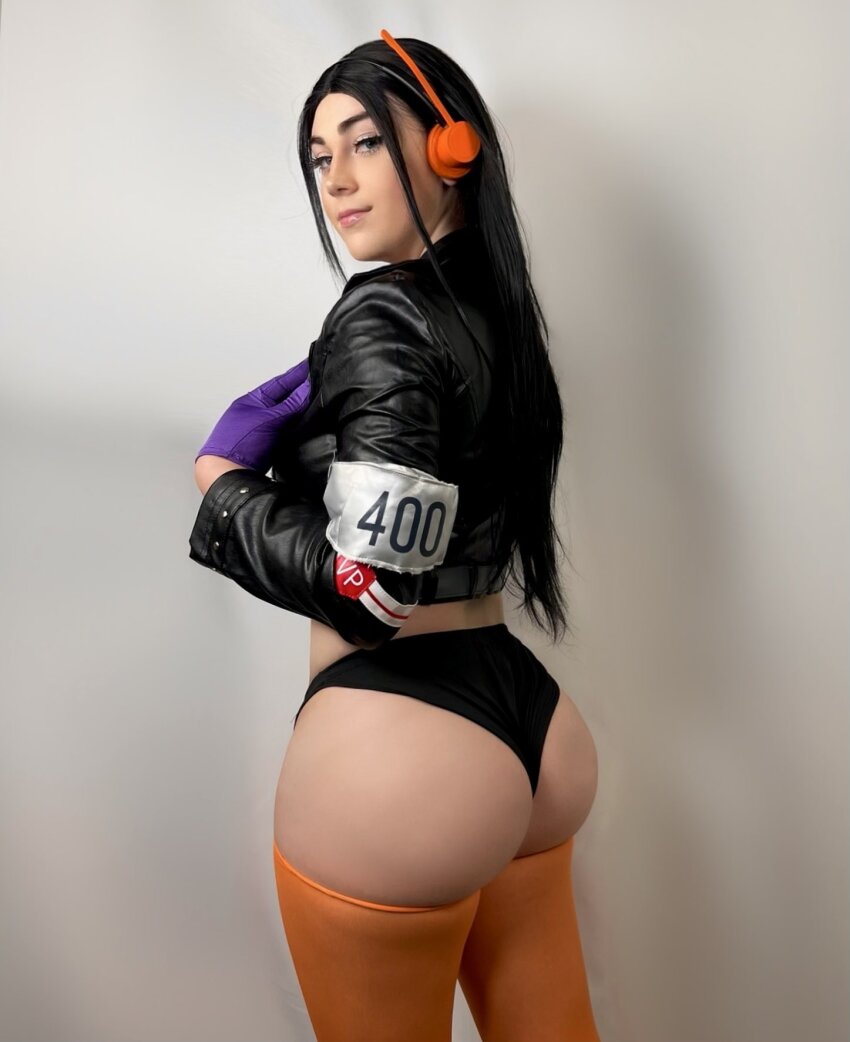 1girl ass ass_focus behind-the-head_headphones black_hair black_panties buttercupcosplays cosplay cowboy_shot cropped_jacket female_focus gloves headphones highres indoors jacket leather leather_jacket light_smile long_hair looking_at_viewer nico_robin nico_robin_(cosplay) nico_robin_(egghead) one_piece panties photo_(medium) real_life sexually_suggestive simple_background smile solo thighhighs underwear