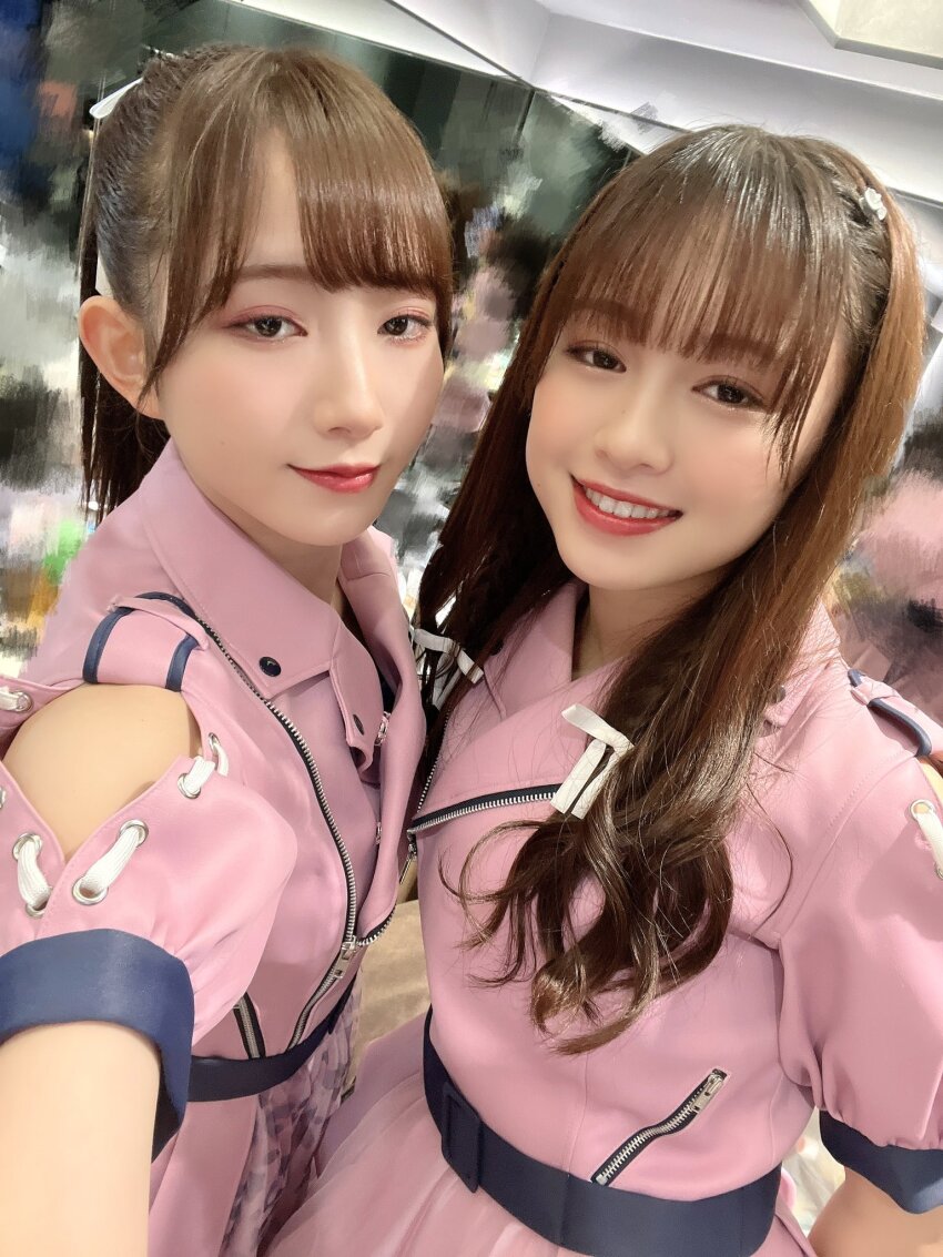 2girls aoyama_nagisa blurry blurry_background costume emori_aya highres indoors looking_at_viewer multiple_girls photo_(medium) simple_background smile standing