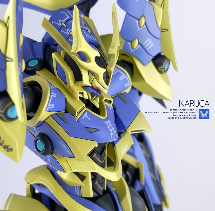 absurdres artist_name character_name close-up copyright_name grey_background highres ikaruga_(knight&#039;s_&amp;_magic) knight&#039;s_&amp;_magic mecha model_kit model_kit_(medium) moderoid no_humans official_art photo_(medium) promotional_art red_eyes robot science_fiction solo suo_(suou_ray) unconventional_media upper_body v-fin