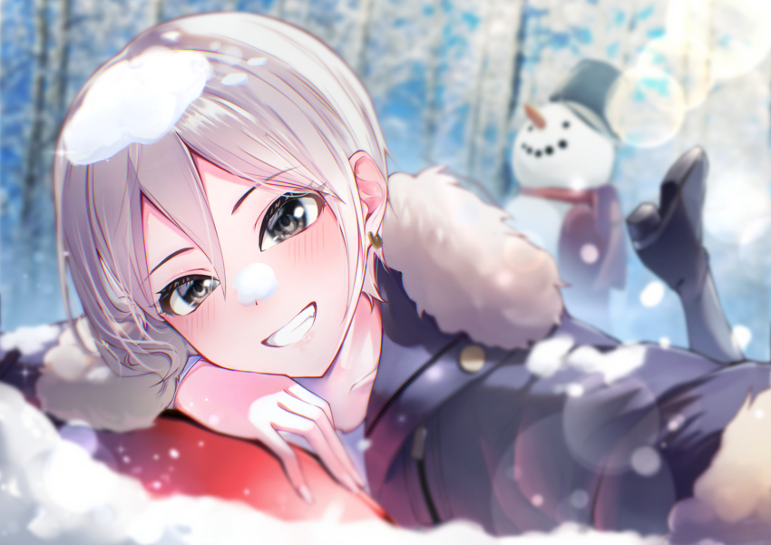1girl black_boots blurry blush boots commentary_request depth_of_field earrings foot_up fur-trimmed_jacket fur_trim grey_eyes grin highres idolmaster idolmaster_cinderella_girls jacket jewelry looking_at_viewer lying on_stomach outdoors selfie shiomi_syuko short_hair smile snow snow_on_head snowman solo tialas white_hair