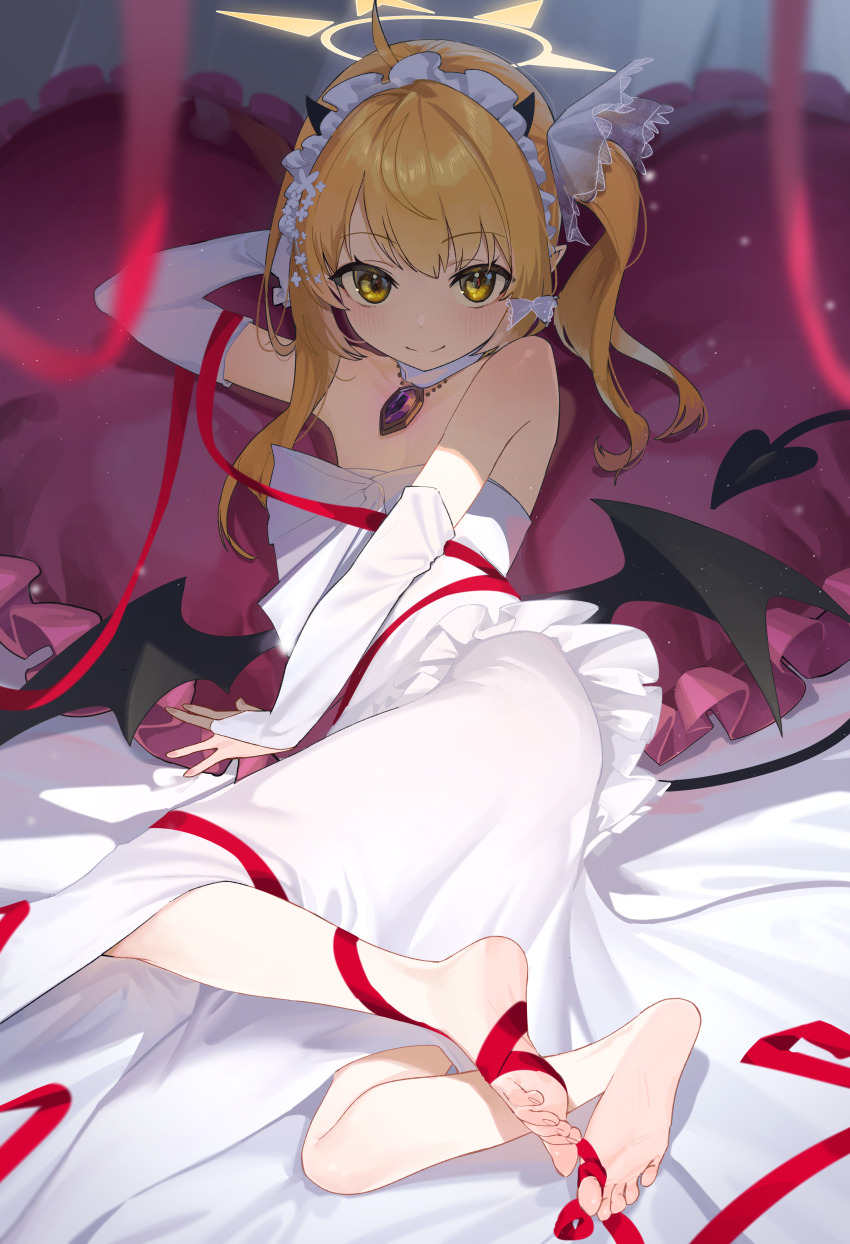 1girl absurdres ahoge alternate_costume arm_behind_head bare_legs bed_sheet blonde_hair blue_archive blurry blurry_foreground blush bongnom bridal_gauntlets cushion demon_horns demon_tail demon_wings depth_of_field detached_collar dress feet frilled_hairband frills gem gloves hairband halo highres horns ibuki_(blue_archive) jewelry looking_at_viewer lying necklace on_side one_side_up red_ribbon ribbon smile soles solo strapless strapless_dress tail toenails toes white_dress white_gloves wings