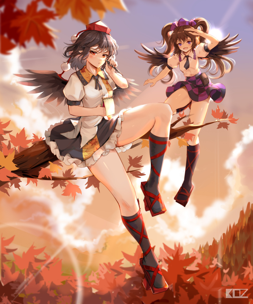 2girls absurdres autumn autumn_leaves bird_wings black_hair black_wings blue_eyes brown_hair brown_wings camera cellphone checkered_clothes checkered_skirt commentary edz_drawz english_commentary evening falling_leaves forest geta ginkgo_leaf hat highres himekaidou_hatate holding holding_leaf kourindou_tengu_costume leaf leaf_print maple_leaf miniskirt multiple_girls nature necktie outdoors phone pom_pom_(clothes) purple_hat red_eyes red_hat shameimaru_aya skirt square-end_necktie sunset tengu tengu-geta tokin_hat touhou tree twintails wind wings