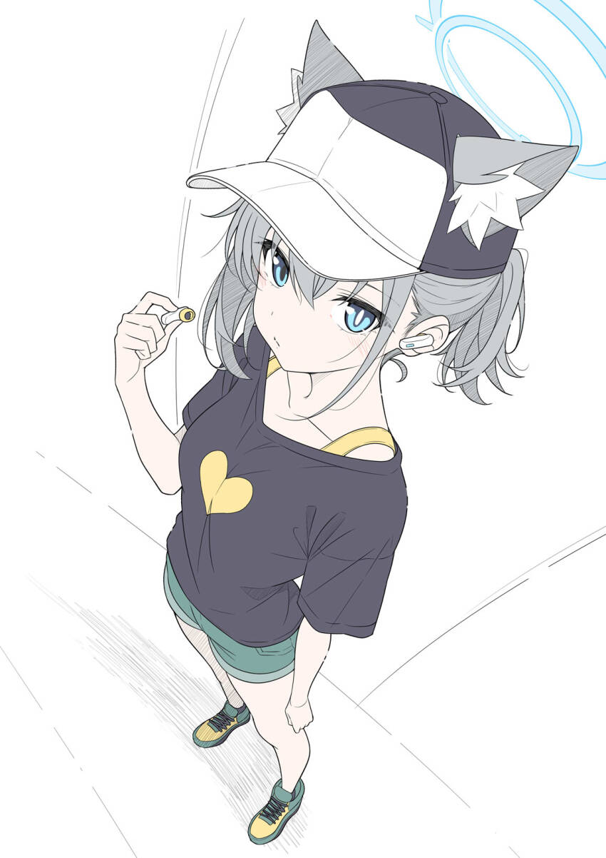 1girl animal_ear_fluff animal_ears baseball_cap black_shirt blue_archive blue_eyes blue_halo blush closed_mouth earphones ears_through_headwear extra_ears from_above green_shoes green_shorts grey_hair halo hat heart heart_print highres holding holding_earphones looking_at_viewer mismatched_pupils shiroko_(blue_archive) shirt shoes short_hair short_sleeves shorts sneakers solo t1kosewad wireless_earphones wolf_ears wolf_girl