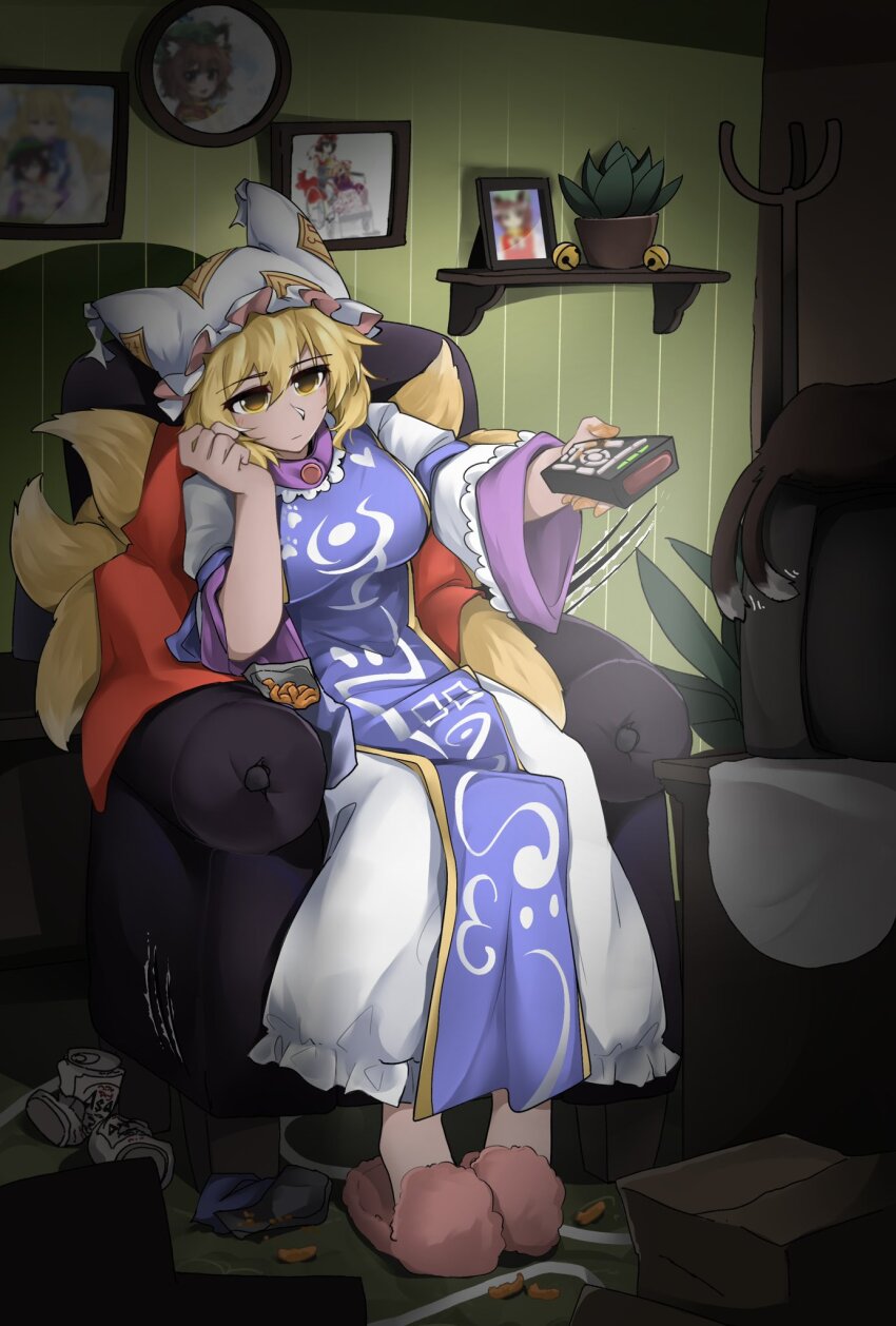 1girl animal_ears armchair blonde_hair blue_tabard chair chen chen_(cat) controller dress fox_ears fox_tail hat highres holding holding_remote_control mob_cap multiple_tails photo_(object) plant potted_plant remote_control sitting slice_of_life slippers statisticstater tabard tail touhou two_tails white_dress wide_sleeves yakumo_ran yellow_eyes