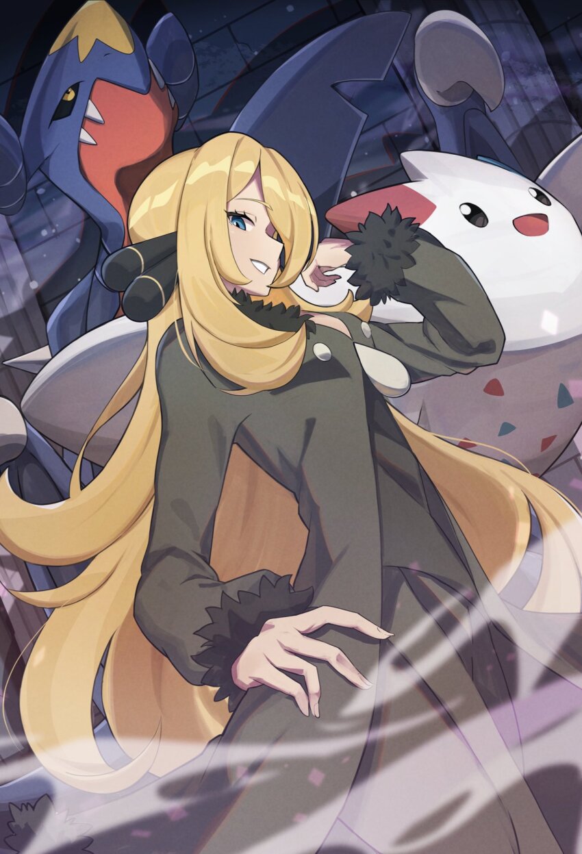 1girl black_coat black_pants black_shirt blonde_hair blue_eyes coat cynthia_(pokemon) fur-trimmed_coat fur-trimmed_sleeves fur_trim garchomp gen_4_pokemon grin hair_ornament hair_over_one_eye hand_on_own_hip highres long_hair long_sleeves mixed-language_commentary nintendo one_eye_covered pants pokemon pokemon_(creature) pokemon_dppt profile shadow shirt smile togekiss umiru