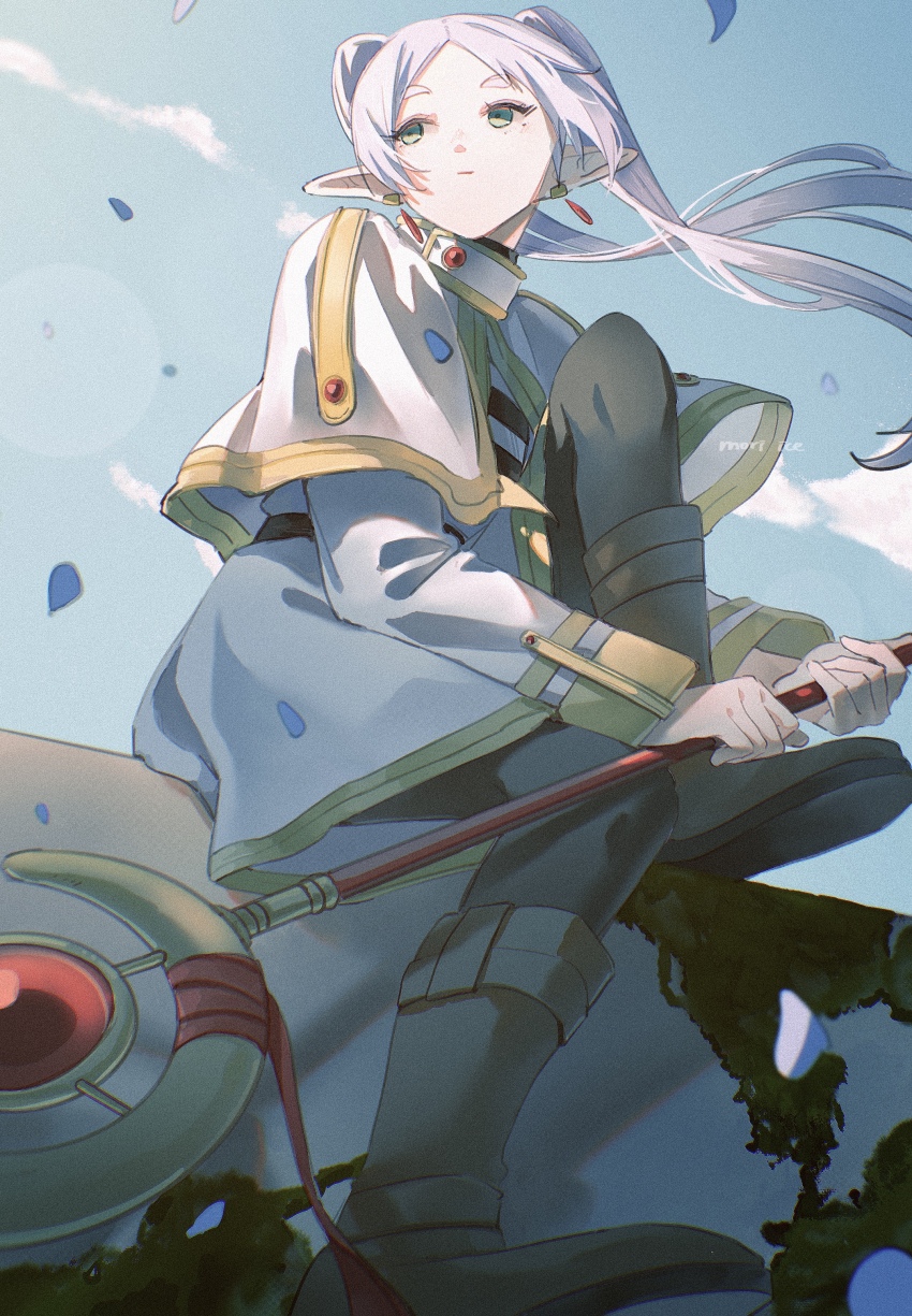 1girl absurdres blue_petals blue_sky capelet earrings elf floating_earring frieren highres holding holding_staff ice_morinaka jewelry mage_staff moss on_rock parted_bangs perspective pointy_ears rock sitting sky solo sousou_no_frieren staff twintails white_capelet wind wind_lift