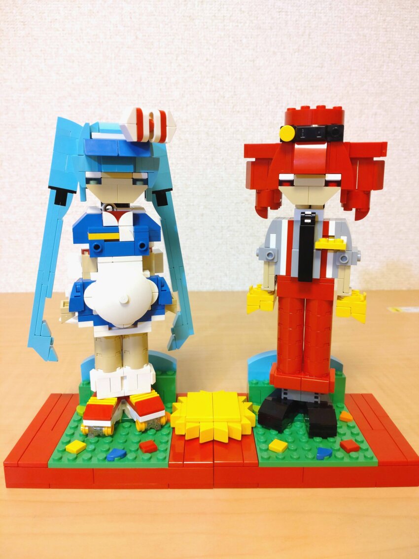2girls alternate_costume apron arms_at_sides black_footwear black_necktie blue_dress blue_eyes blue_hair bow choroli_(chorolin) commentary dress drill_hair full_body gloves grey_shirt hair_bow hat hatsune_miku highres kasane_teto lego lego_(medium) long_hair looking_at_viewer mesmerizer_(vocaloid) multiple_girls necktie pants red_eyes red_footwear red_hair red_hat red_pants roller_skates shirt shoes short_dress short_sleeves skates sleeves_rolled_up socks standing striped_bow suspenders twin_drills twintails unconventional_media utau very_long_hair vocaloid white_apron white_socks yellow_gloves