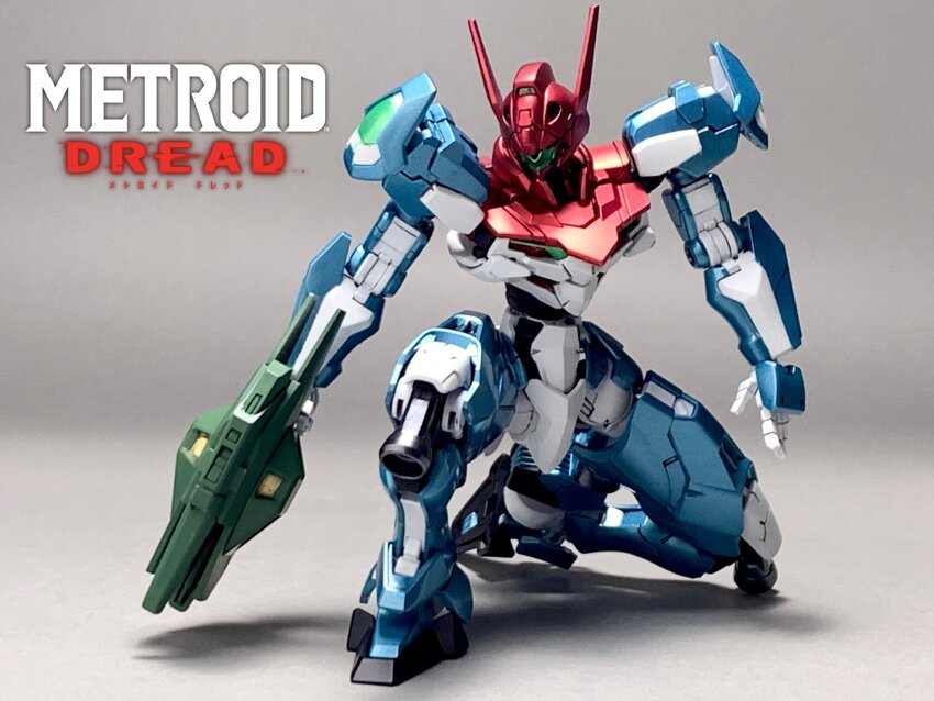 copyright_name fusion gun gundam gundam_lfrith gundam_suisei_no_majo gunpla highres holding holding_gun holding_weapon logo mecha metroid metroid_dread model_kit model_kit_(medium) nintendo no_humans on_one_knee open_hand photo_(medium) robot salty_zetasuki samus_aran shadow solo unconventional_media weapon