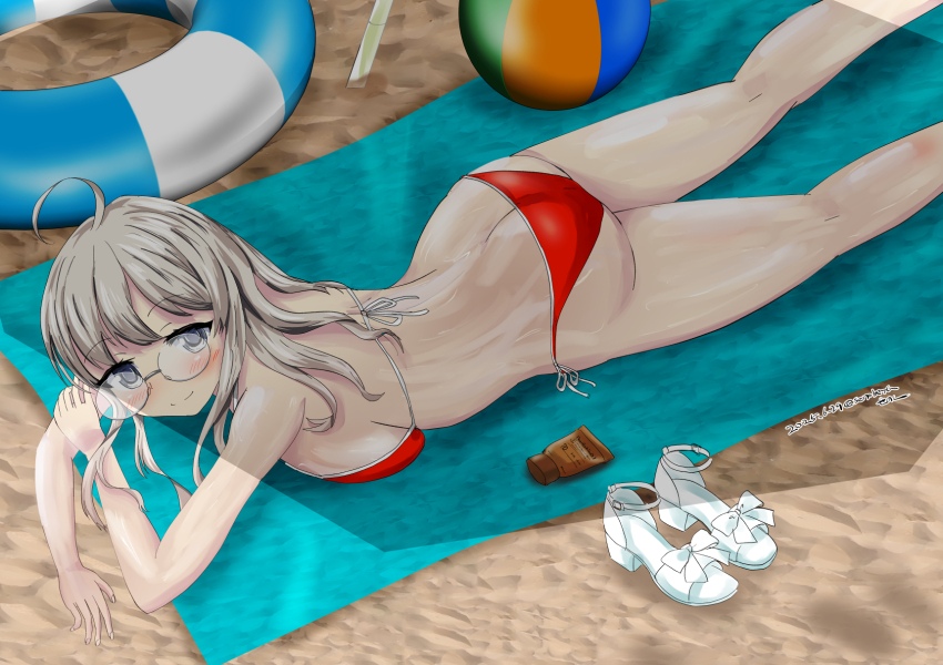 1girl ahoge ball beach_towel beachball bikini breasts feet_out_of_frame glasses grey_eyes grey_hair heywood_l._edwards_(kancolle) highres innertube kantai_collection large_breasts long_hair lotion lying on_stomach red_bikini sand senon shade shoes solo sunscreen swim_ring swimsuit towel unworn_shoes