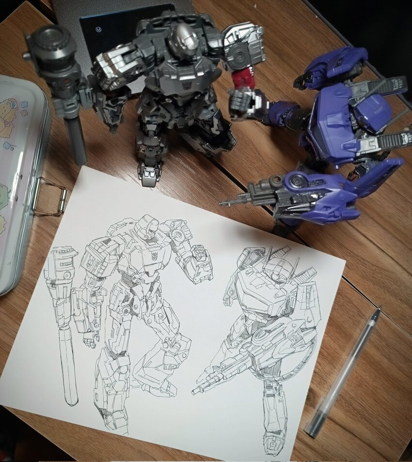arm_cannon art_tools_in_frame bumblebee_(film) cable clenched_hand commentary decepticon english_commentary figure from_above highres mecha mecha_focus megatron no_humans one-eyed pen photo_(medium) robot shockwave_(transformers) subakeye transformers transformers:_rise_of_the_beasts transformers_(live_action) weapon