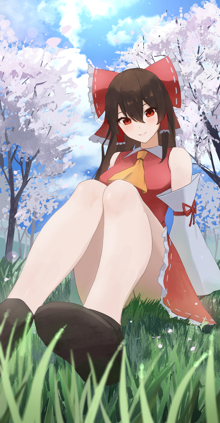 1girl absurdres arm_support ascot ass bare_shoulders bow branch brown_hair cherry_blossoms day detached_sleeves from_below grass hair_between_eyes hair_bow hair_tubes hakurei_reimu highres knees_together_feet_apart long_hair looking_at_viewer on_grass outdoors palulap perspective petals red_bow red_eyes sitting sky smile solo touhou tree