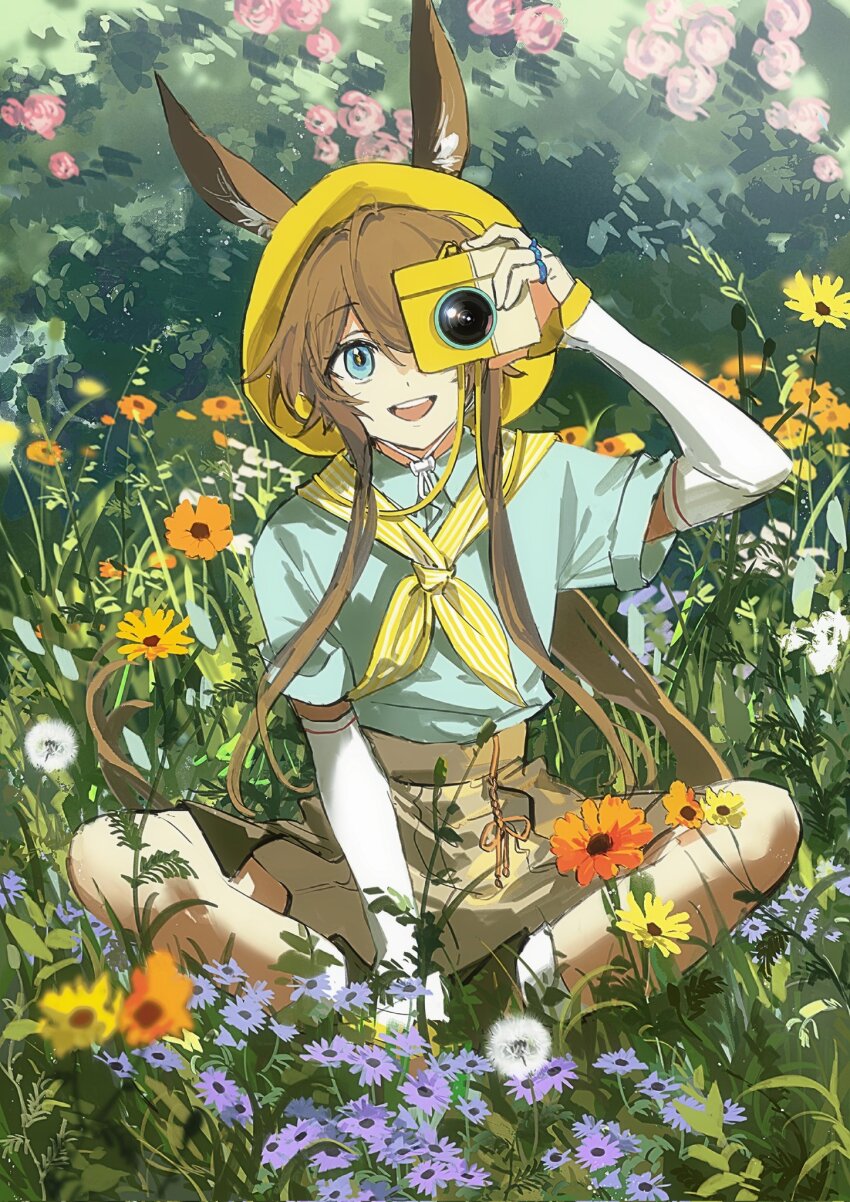 1girl amiya_(arknights) animal_ears aqua_shirt arknights blue_eyes brown_hair brown_shorts camera detached_sleeves flower grass hat highres holding holding_camera long_hair looking_at_viewer on_grass one_eye_covered open_mouth rabbit_ears rabbit_girl shirt short_sleeves shorts sitting solo teeth upper_teeth_only white_sleeves yanfenguo_gao yellow_hat