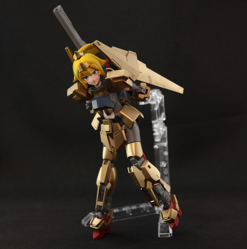 1girl absurdres black_background blonde_hair blue_eyes commentary cosplay english_commentary gundam gunpla hat_(thehatweaver) highres hoshino_char hyaku_shiki hyaku_shiki_(cosplay) leaning_forward mecha_musume model_kit model_kit_(medium) photo_(medium) smile solo tsunderia unconventional_media virtual_youtuber zeta_gundam