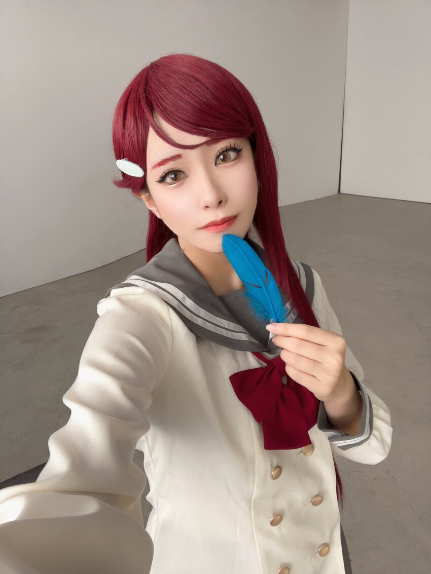 1girl blue_feathers cosplay cosplay_photo feathers honamen_cos indoors lipstick long_hair looking_at_viewer love_live! love_live!_sunshine!! makeup photo_(medium) red_hair sakurauchi_riko school_uniform selfie standing yellow_eyes