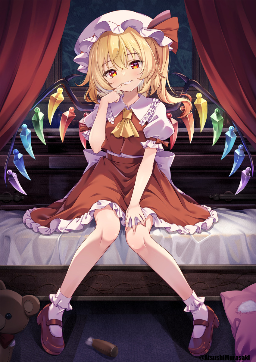 1girl bed blonde_hair blush crystal fingernails flandre_scarlet frilled_skirt frills grin hair_between_eyes hat hat_ribbon highres long_hair looking_at_viewer mob_cap murasaki_atsushi one_side_up red_eyes red_ribbon red_shoes red_skirt red_vest ribbon shoes sitting skirt smile socks solo stuffed_animal stuffed_toy teddy_bear touhou twitter_username vest white_hat white_socks wings